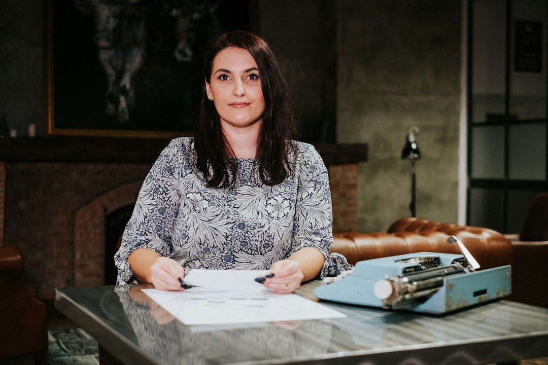 woman checking documents at desk